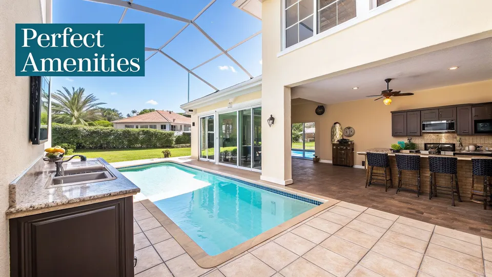 Luxury villa outdoor space with swimming pool, covered kitchen, and dining bar area, offering perfect amenities.